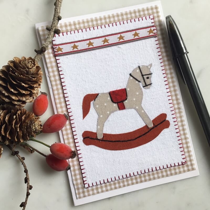 Weihnachtskarte Schaukelpferd